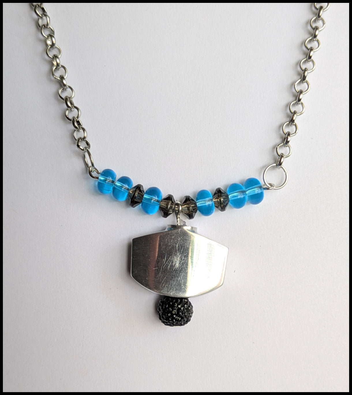 Blue and black tuner button necklace