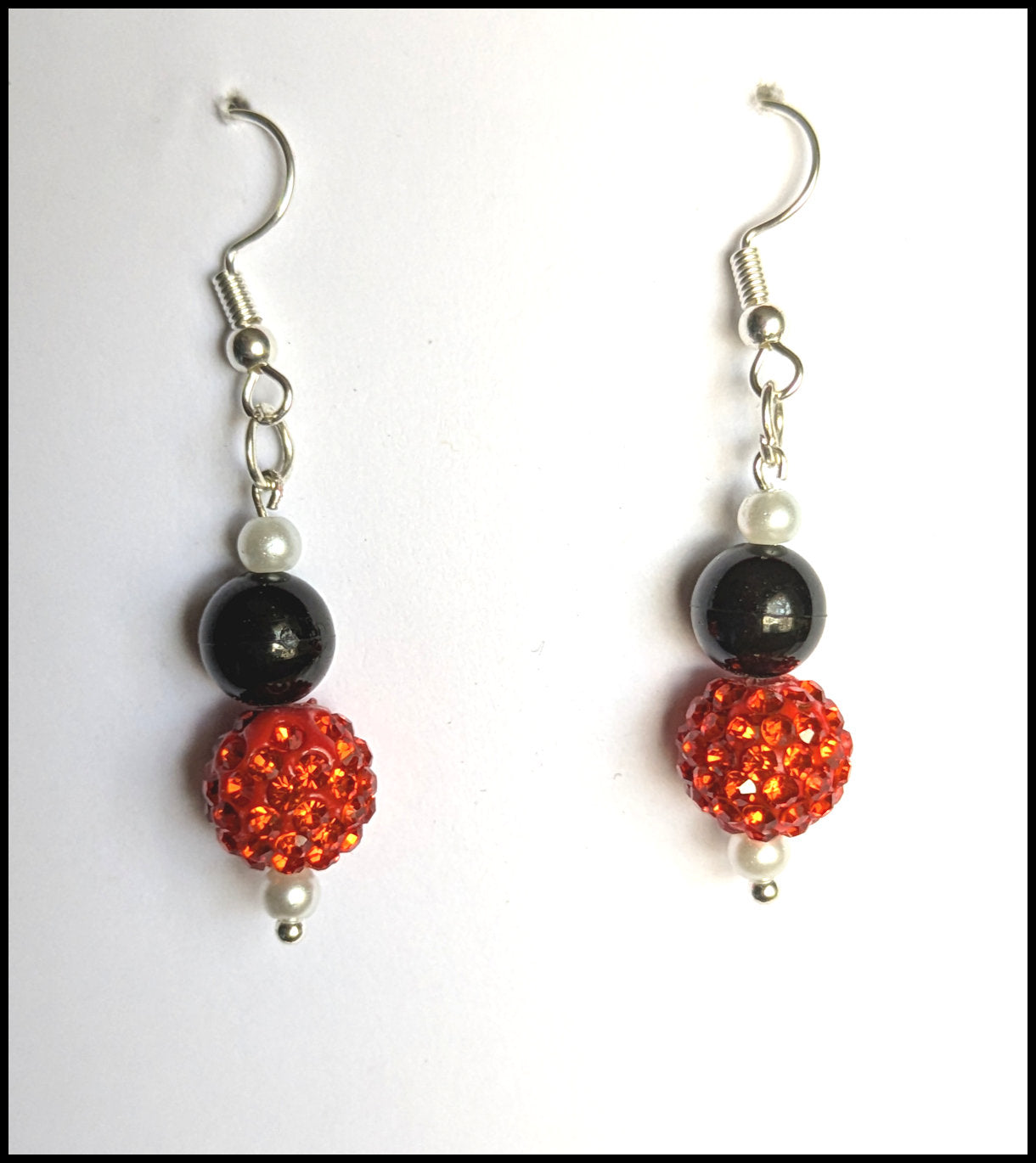Shimmering orange and black earrings