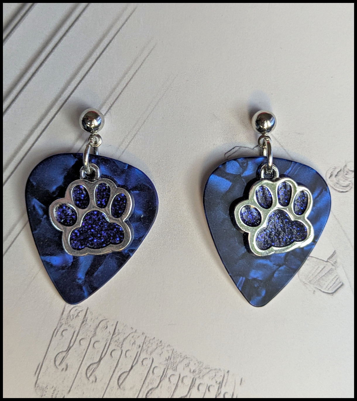 Music and paw print earrings