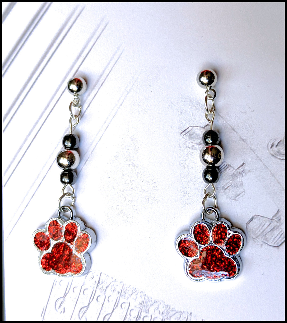 Paw print dangle earrings