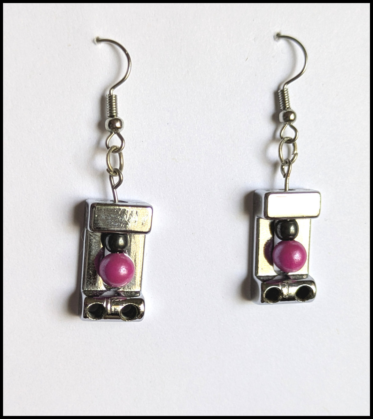 Silver bridge saddle earrings
